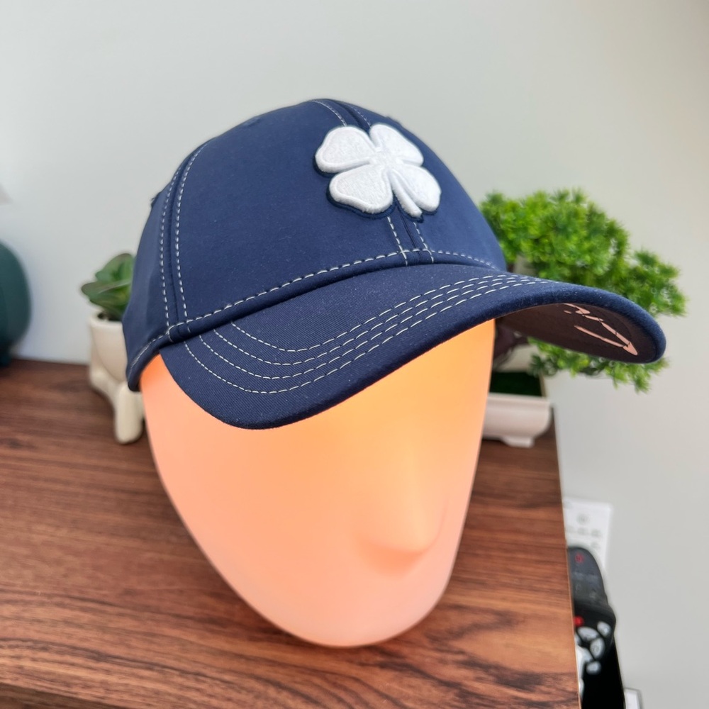 Black Clover brand “Live Lucky Navy Blue Ball Cap with White embroidered clover